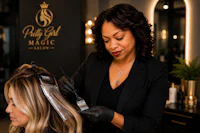 a woman is getting her hair done at a hair salon